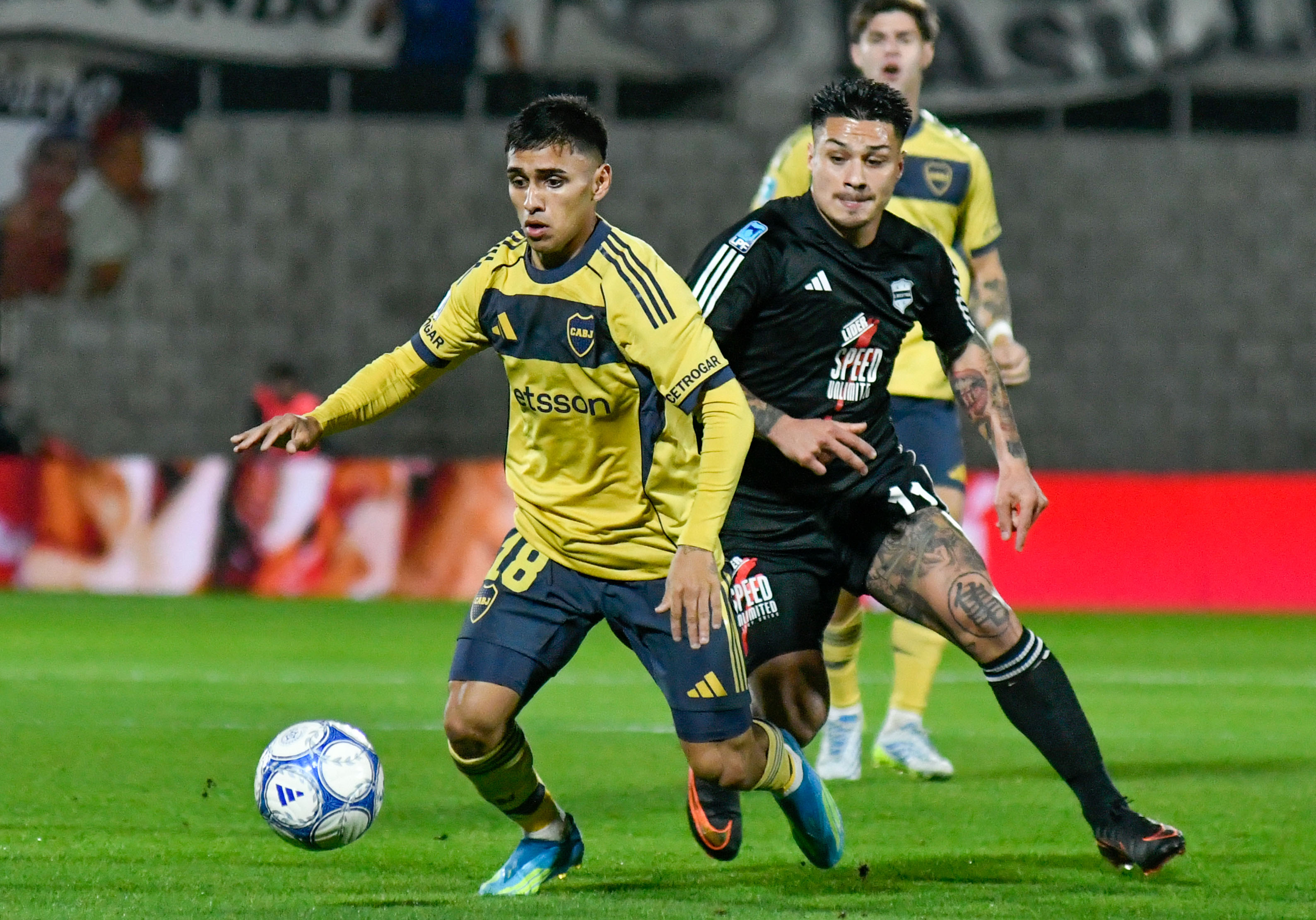 Buenos Aires, Argentina – July 26, 2026: Milton Delgado (18) of boca jrs and Alexander Díaz (11) of Riestra. Deportiv...